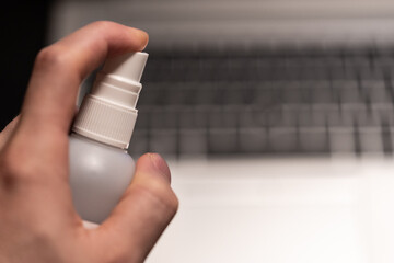 Covid19 disinfection of the business workplace with laptop working from home