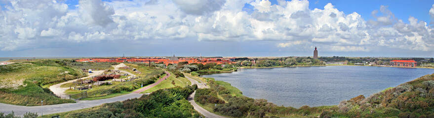 Fototapeta na wymiar Panoramic view on Westkapelle, Zeeland, Netherlands, with a creek created when the sea broke through the coastal defence