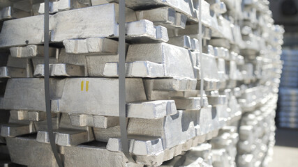 Aluminum ingots in Stock Warehouse. Billets for aluminium profile production at a metallurgical plant