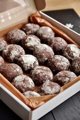 cracked chocolate cookies in a white box