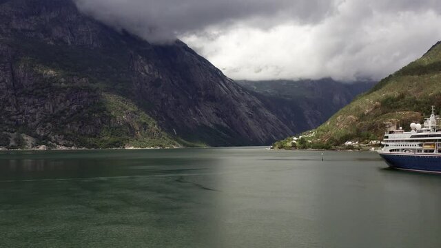 Aerial view of fjord and cruise ship liner. Drone shot of Norwegian landscape