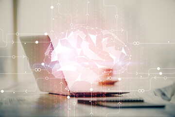 Double exposure of desktop with computer and brain drawing hologram. Artificial intelligence...