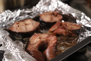 Close-up of baked fish in foil.