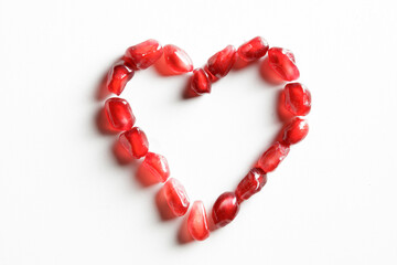 Pomegranate heart isolated on white background
