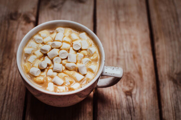 Still Life composition.White cup of coffee with.marshmallow  on the wooden background