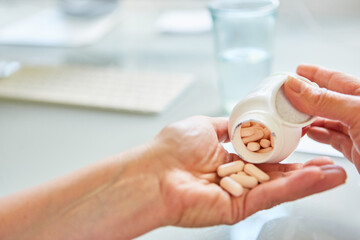 Patient pours pills on his hand