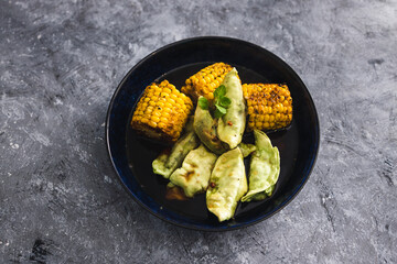 plant-based food, vegetable gyoza with grilled corn on the cobs