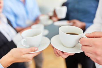 Business people having a break while drinking coffee