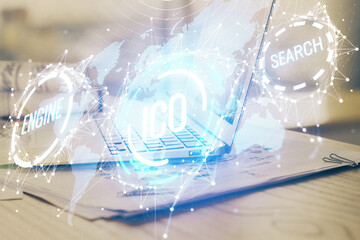 Double exposure of blockchain theme hologram and table with computer background. Concept of bitcoin crypto currency.