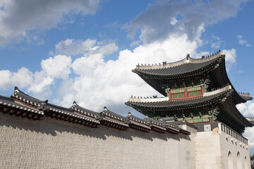 Fototapeta premium Gyeongbokgung palace landmark of Seoul, South Korea. roof with sky and cloud.
