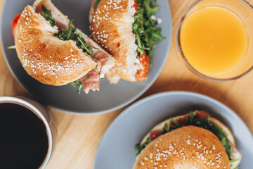 delicious and appetizing breakfast: a bagel stuffed on a plate