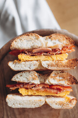 cut in half a bagel which is full of delicious juicy stuffing. Appetizing breakfast close up