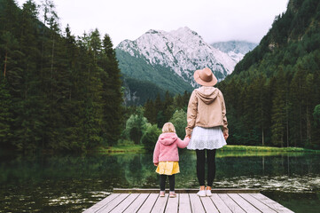 Mother and daughter together on nature. Family outdoor.