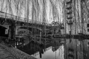 Black and white photo of the Carrow Bridge crossing over the River Wensum in the city of Norwich 