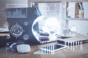 Financial chart drawing and table with computer on background. Double exposure. Concept of international markets.