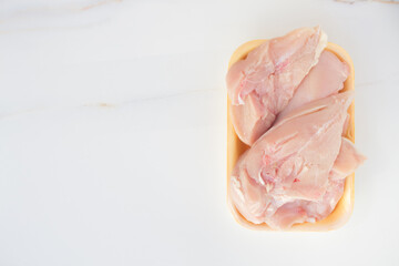  Fresh chicken meat in packaging only from the store. Chicken fillet on table with copy space