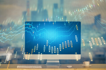 Stock market chart hologram drawn on personal computer background. Multi exposure. Concept of investment.