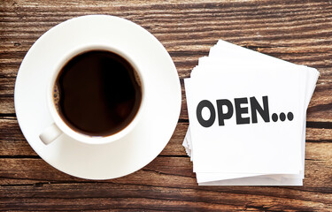 Word writing text OPEN . Business concept for Urgent Move.Text in stickers with a cap of coffee