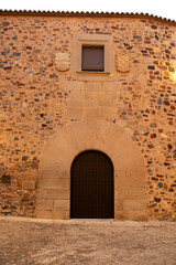 Old house facade in historic city of Caceres, Spain.