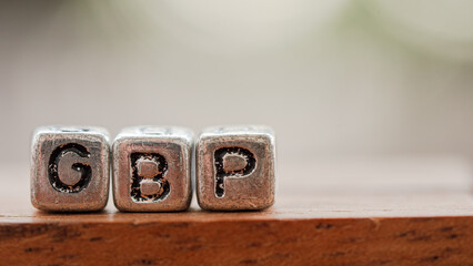 Three silver blocks placed in a row labeled 