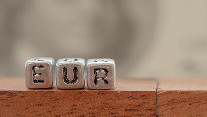 Three silver blocks placed in a row labeled 