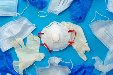 Protective equipment, masks and gloves, on blue background