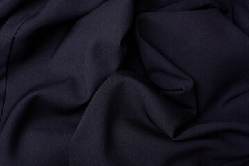 Fototapeta premium Black fabric folds background. View from above. Black friday concept sale