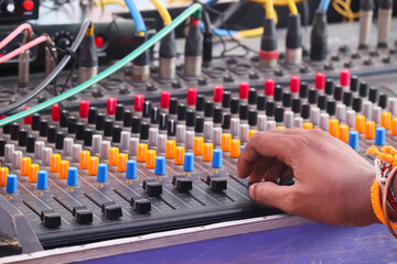 Electronics Musical Sound Mixer Equalizer Console And Hands Of Man Adjusting Or Operating The Knobs...