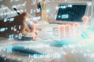 Science formula hologram over woman's hands taking notes background. Concept of study. Double...