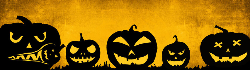 HALLOWEEN background banner wide panoramic panorama template -Silhouette of scary carved luminous cartoon pumpkins isolated on dark orange dusty texture