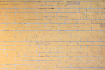 Obraz premium Yellow background wall of decorative bricks.