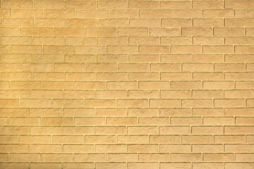 Yellow background wall texture from decorative bricks.