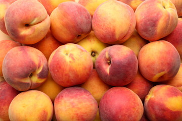 Fototapeta na wymiar Fresh ripe peaches as background, top view