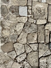 Rock texture for background detail. Old castle stone wall texture, floor background. Wide panoramic rock pattern. Natural masonry surface, brick frame. Grunge structure. Ancient stones wallpaper.