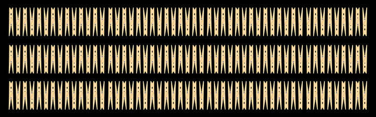 White housewife clothespins isolated on black background