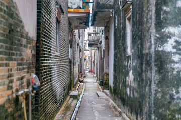 Fototapeta premium The rural street view of old traditional fisherman village on Hainan in China