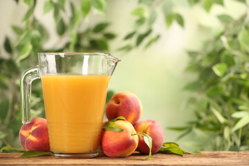 Natural peach juice and fresh fruits on wooden table. Space for text
