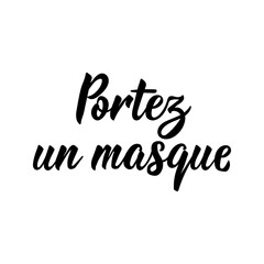 Wear a mask - in French language. Lettering. Ink illustration. Modern brush calligraphy.