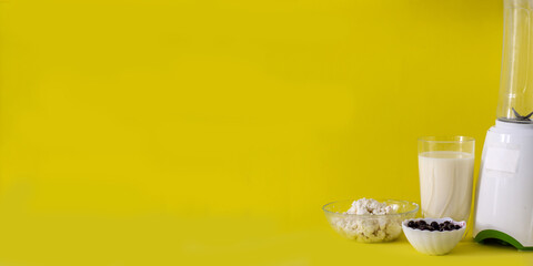 smoothie with cottage cheese and fresh berries on a solid yellow background