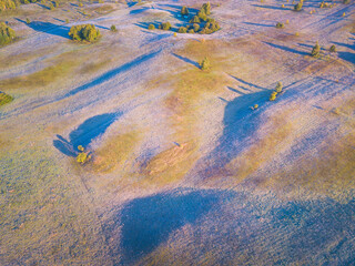Landscape with frost shadows in the early autumn morning