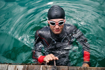 triathlete swimmer portrait wearing wetsuit on training