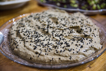 Mediterranean Eggplant salad, served in a glass, decorated with nigella