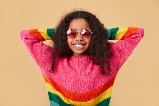 Happy black kid in rainbow sweater
