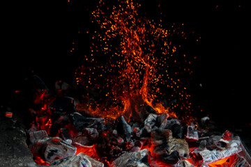 Sparkle of fire and coal burning