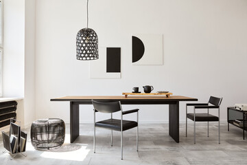 Stylish dining room interior with design wooden family table, black chairs, teapot with mug, mock...