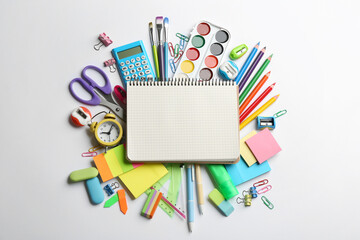 Blank notebook and school stationery on white background, flat lay with space for text. Back to school