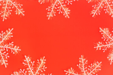 Snowflakes on a red background. Flat lay.