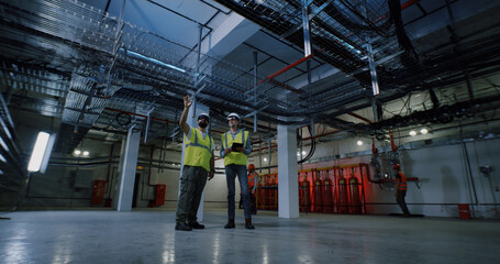 Engineers examining interior of power station
