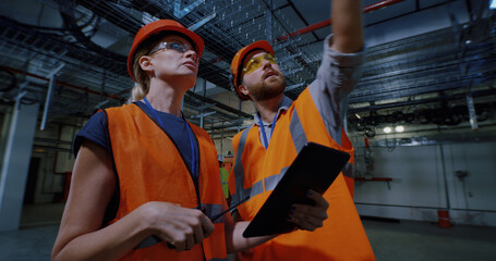 Engineer showing workshop to inspector