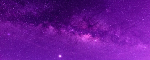 Panorama blue , purple night sky milky way and star on dark background.Universe filled with stars, nebula and galaxy with noise and grain.Photo by long exposure and select white balance. 